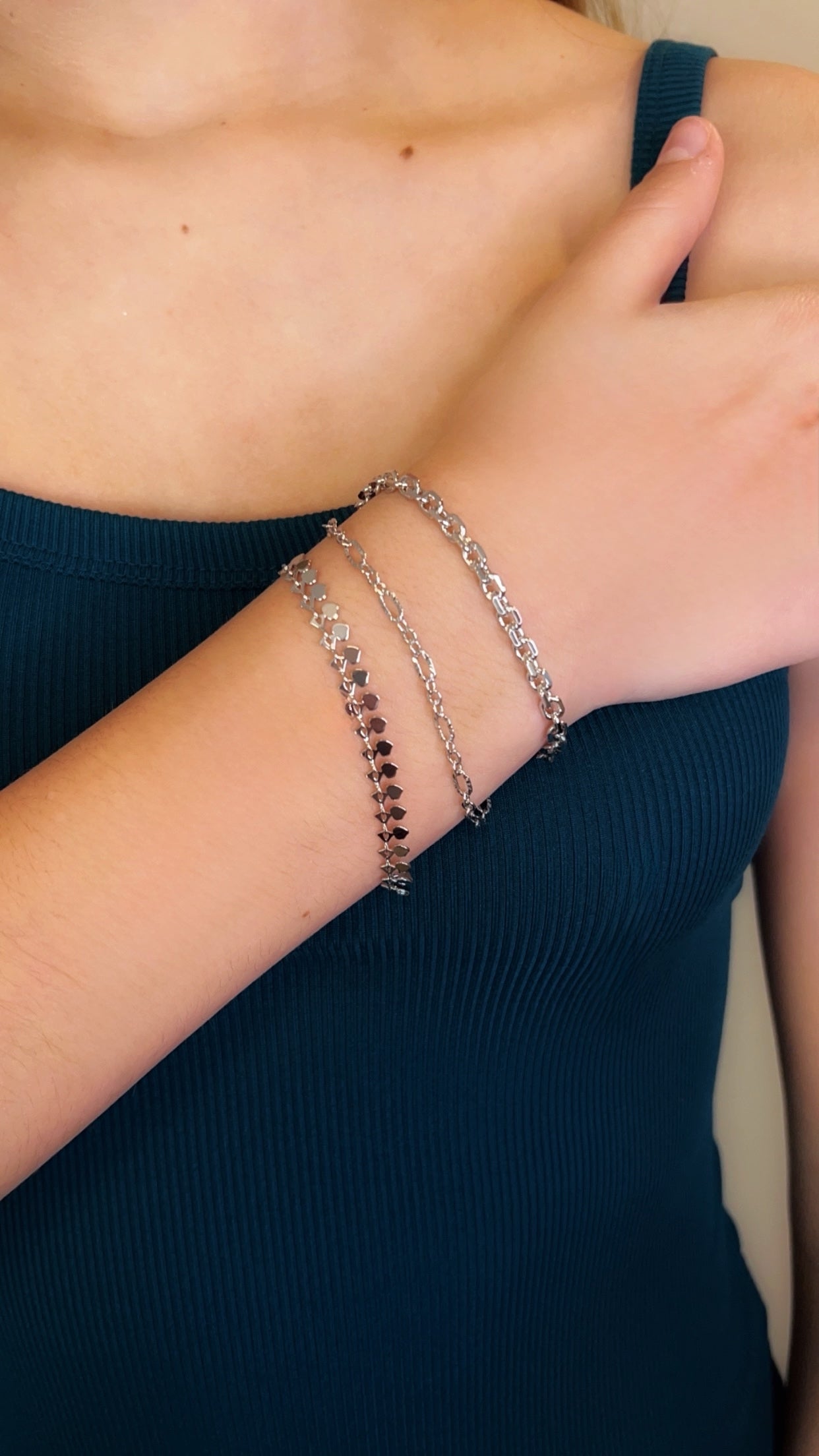 Three individual Silver Clasp Bracelets